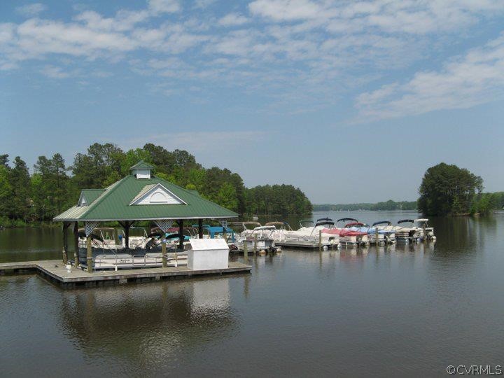 5603 Standing Oak Road Midlothian, VA 23112 - Photo 37 of 39 a view of swimming pool with outdoor seating and lake view