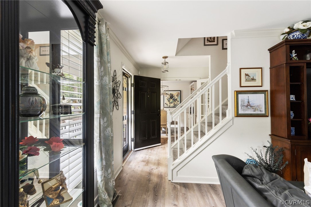 5603 Standing Oak Road Midlothian, VA 23112 - Photo 7 of 39 a view of entryway and hall with wooden floor