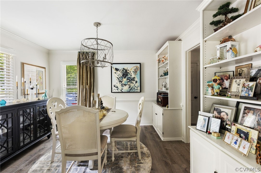 5603 Standing Oak Road Midlothian, VA 23112 - Photo 9 of 39 a dining room with wooden floor and furniture