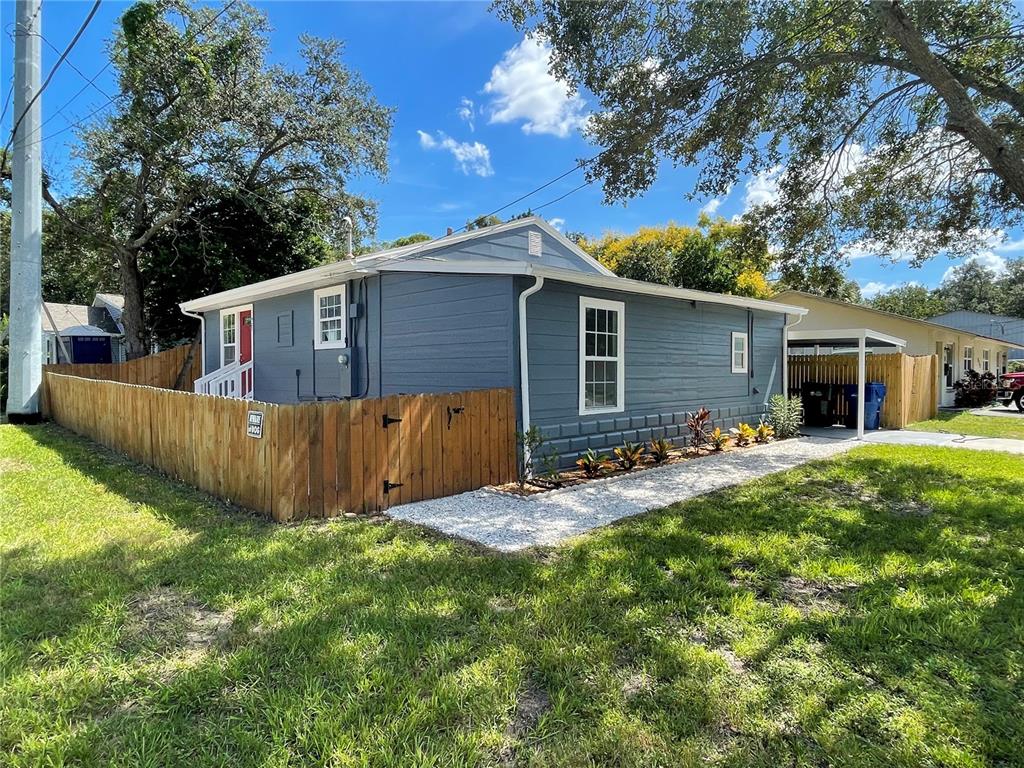 923 8th Avenue Southwest Largo, FL 33770 - Photo 1 of 1 Side view of the residence.