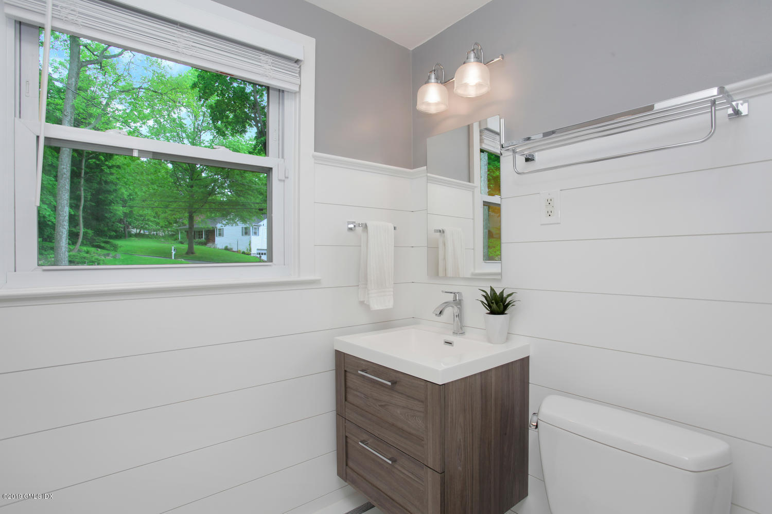 34 Dandy Drive Cos Cob, CT 06807 - Photo 16 of 20 a bathroom with a sink vanity and a toilet