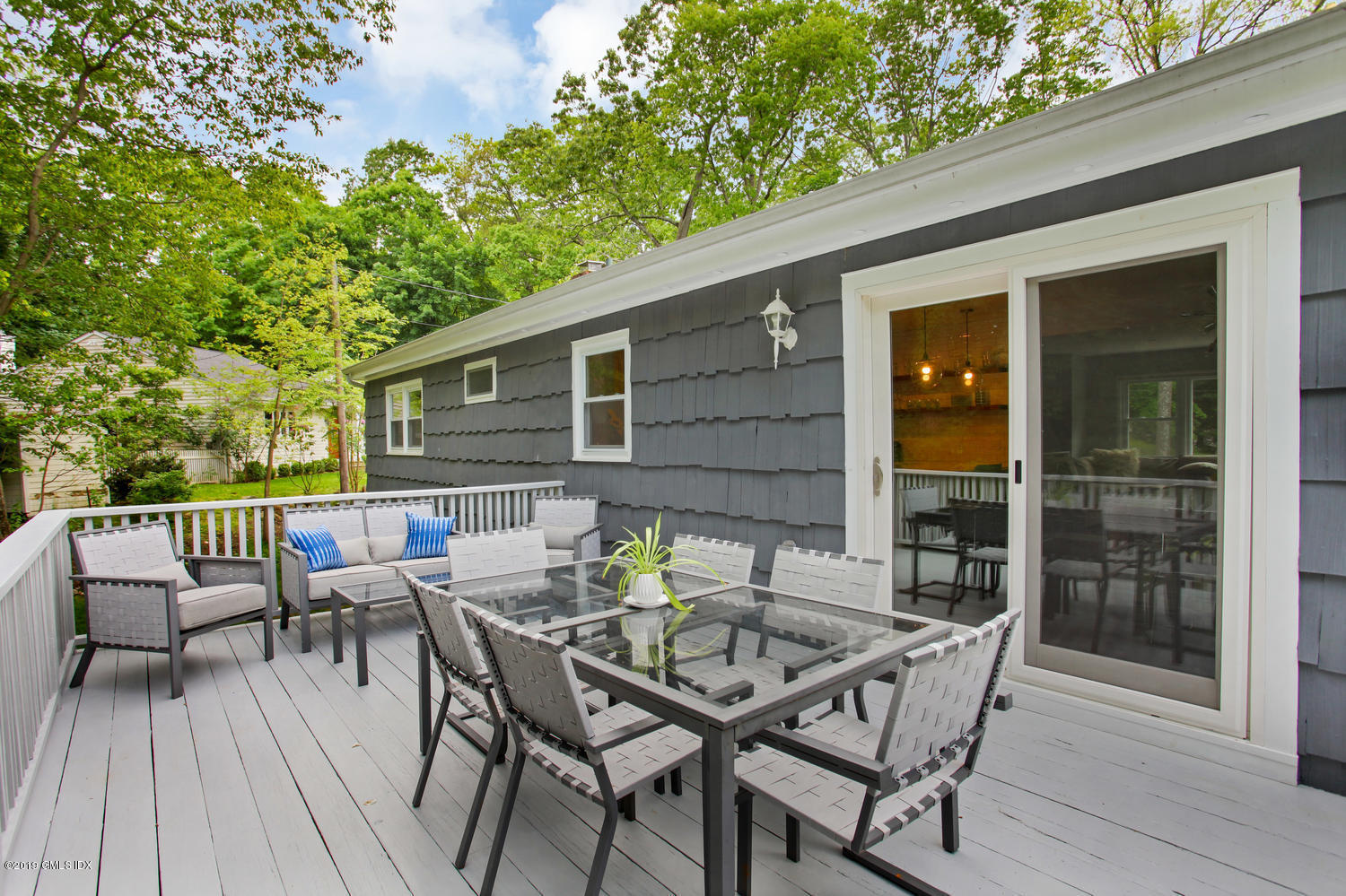 34 Dandy Drive Cos Cob, CT 06807 - Photo 17 of 20 a view of a patio with a table and chairs
