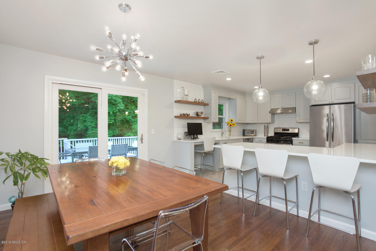 34 Dandy Drive Cos Cob, CT 06807 - Photo 3 of 20 a view of a dining room with furniture a chandelier and wooden floor