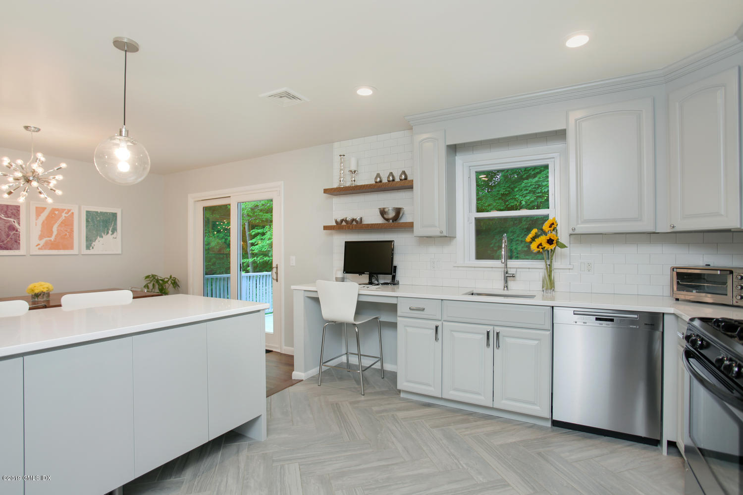 34 Dandy Drive Cos Cob, CT 06807 - Photo 4 of 20 a kitchen that has a sink and a stove in it