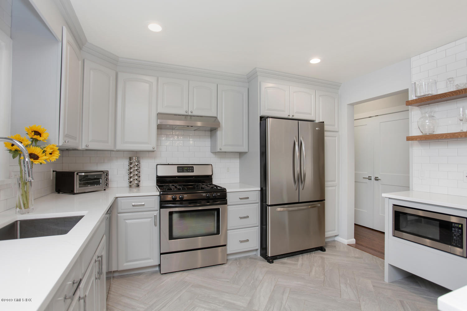 34 Dandy Drive Cos Cob, CT 06807 - Photo 5 of 20 a kitchen with stainless steel appliances a refrigerator sink and stove