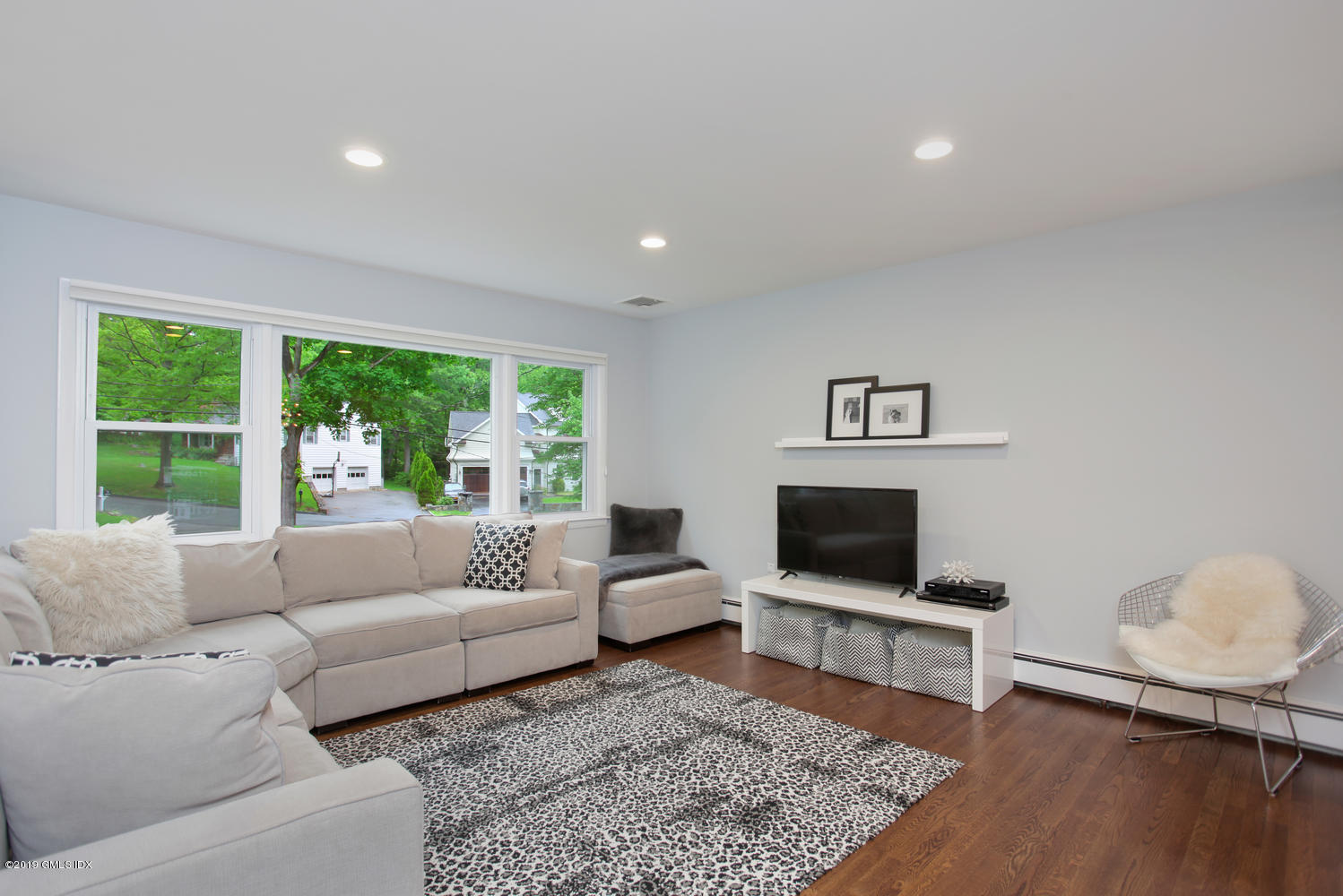 34 Dandy Drive Cos Cob, CT 06807 - Photo 7 of 20 a living room with furniture and a flat screen tv