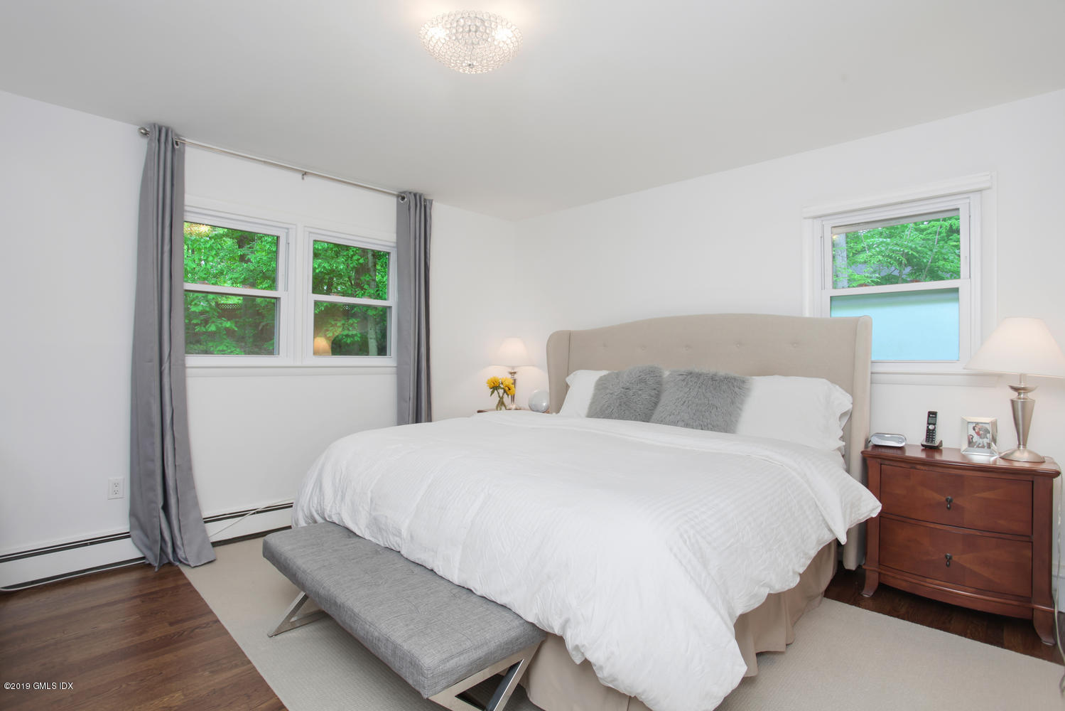 34 Dandy Drive Cos Cob, CT 06807 - Photo 9 of 20 a bedroom with a bed and a window