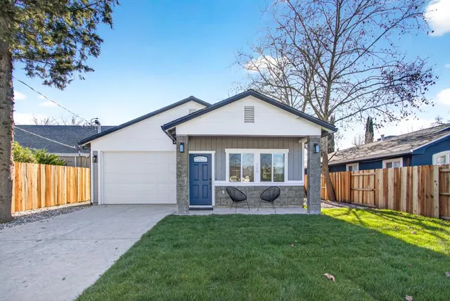 a front view of a house with garden