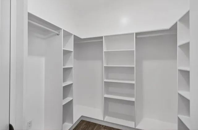 a view of an empty walk in closet