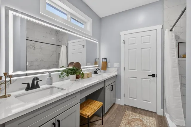 a bathroom with a sink and a mirror