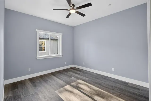 a view of room with window and ceiling fan