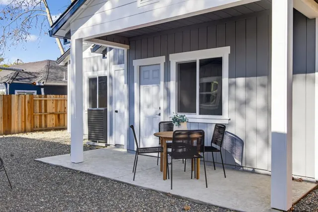 a patio with table and chairs