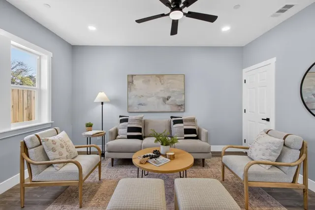a living room with furniture and a large window