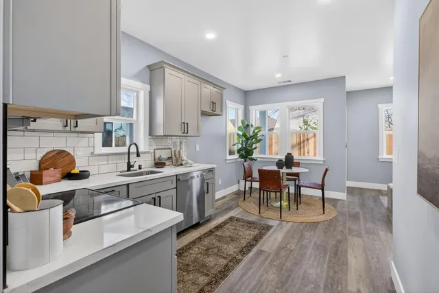 a kitchen with dining table and chairs