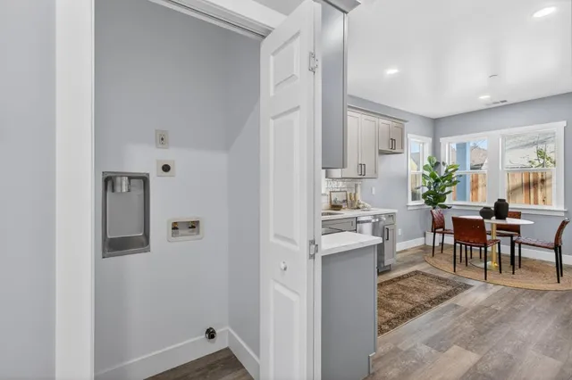a view of a dining hall with furniture and a window