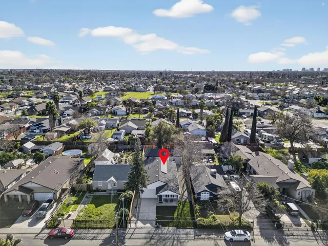 an aerial view of residential houses with city view