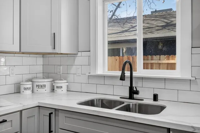a kitchen with a sink and cabinets