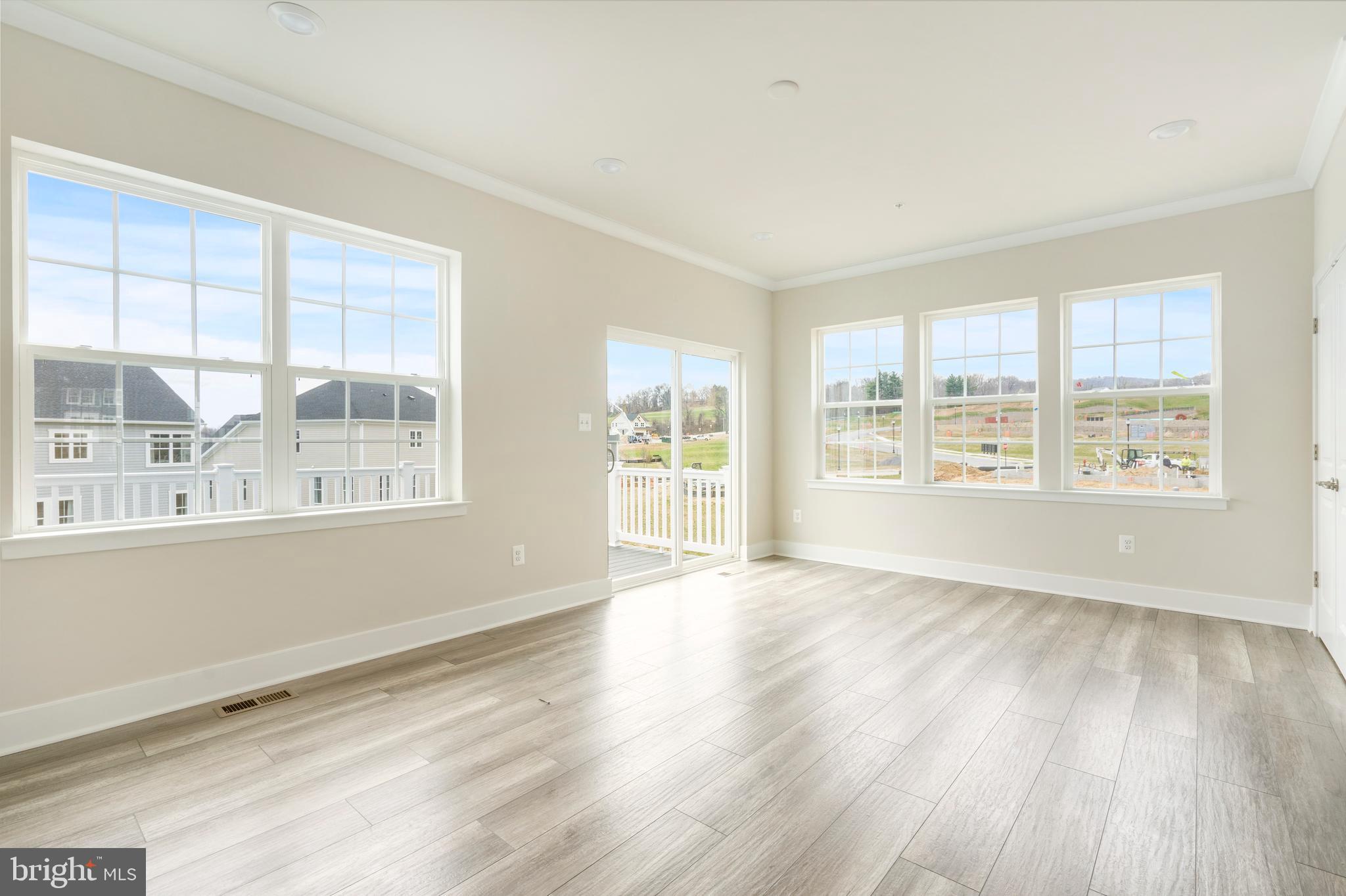 1425 Clingmans Dome Drive Frederick, MD 21702 - Photo 11 of 46 a view of an empty room with wooden floor and a window