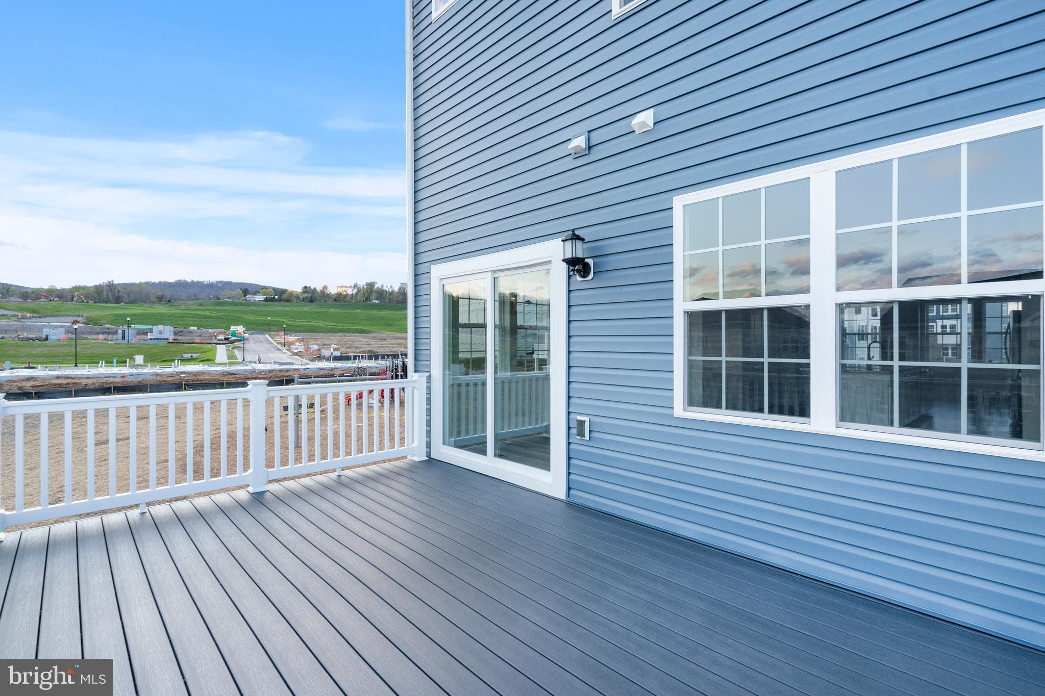 1425 Clingmans Dome Drive Frederick, MD 21702 - Photo 40 of 46 a view of a roof deck with wooden floor and fence and floor to ceiling window