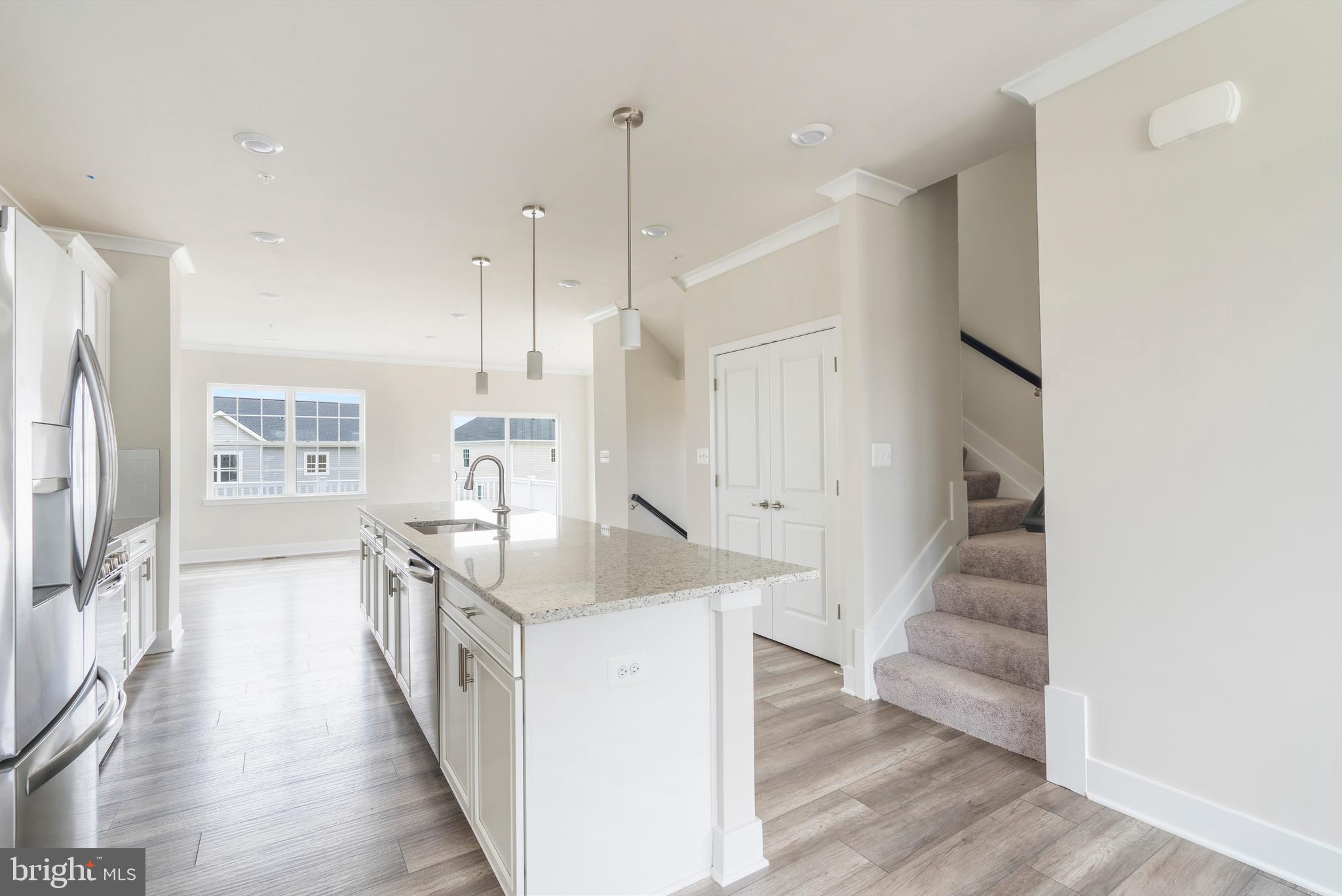 1425 Clingmans Dome Drive Frederick, MD 21702 - Photo 4 of 46 a kitchen with stainless steel appliances granite countertop a sink and a refrigerator