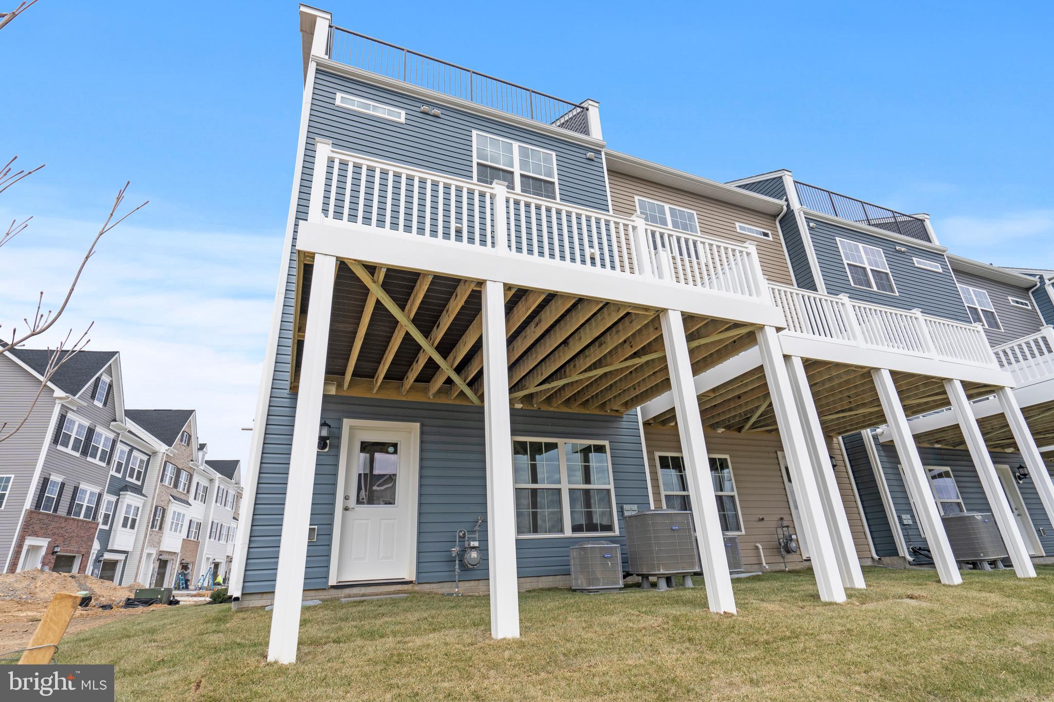 1425 Clingmans Dome Drive Frederick, MD 21702 - Photo 43 of 46 a front view of a house with a yard