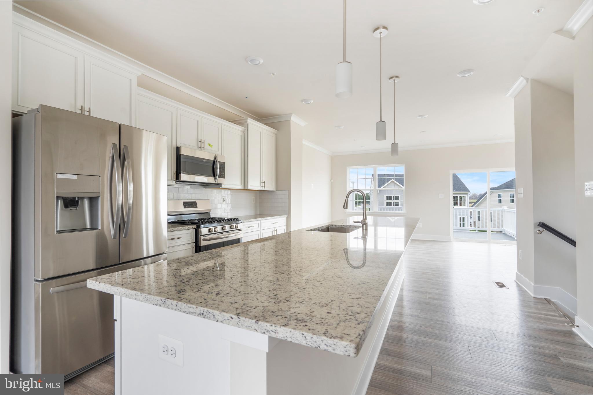 1425 Clingmans Dome Drive Frederick, MD 21702 - Photo 5 of 46 a kitchen with stainless steel appliances granite countertop a refrigerator a stove and a sink