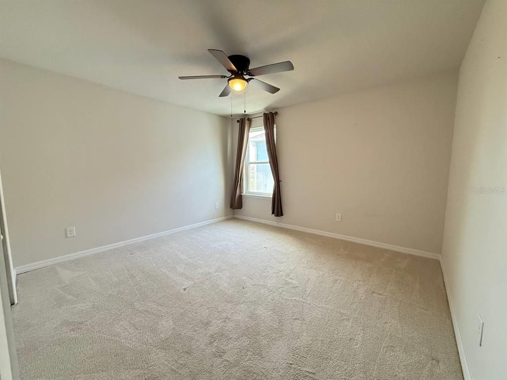 14112 Poke Ridge Drive Riverview, FL 33579 - Photo 16 of 32 a view of an empty room with a window