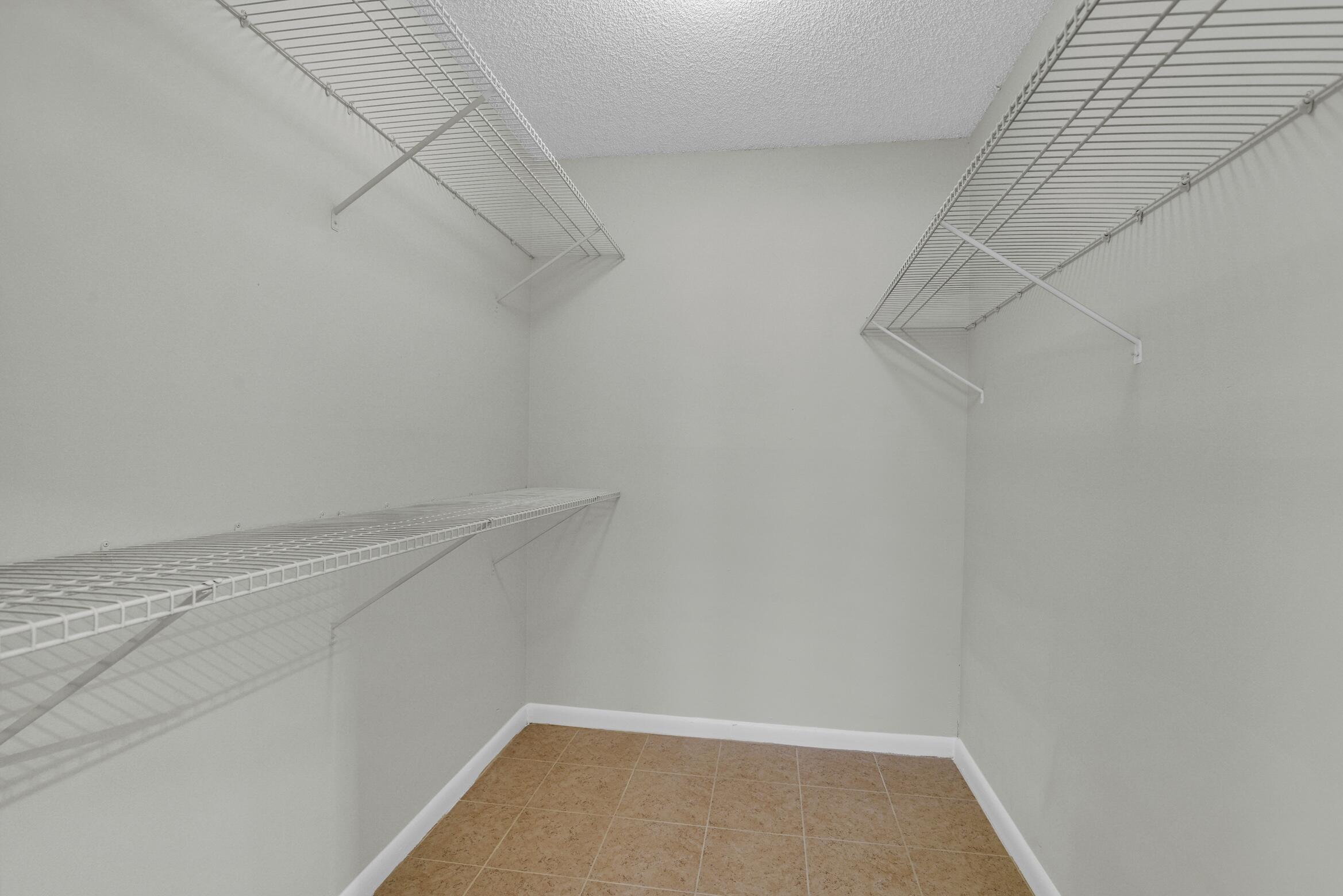 6620 Boca Del Mar Drive, Unit 105 Boca Raton, FL 33433 - Photo 8 of 21 binder walk in closet