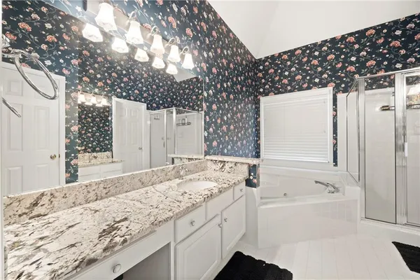 a bathroom with a bathtub and a sink