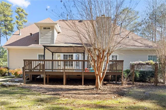 a house with swimming pool in front of it