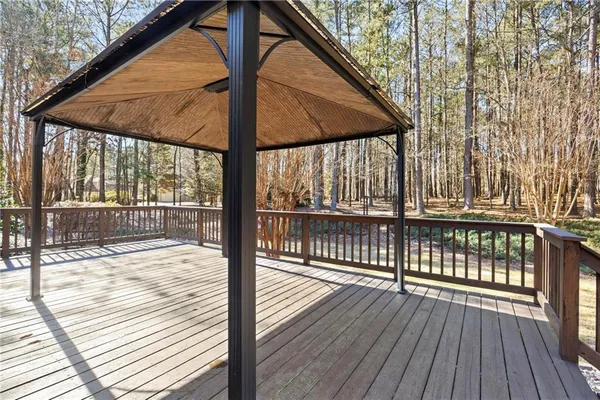 a view of deck with wooden floor and wooden floor and fence