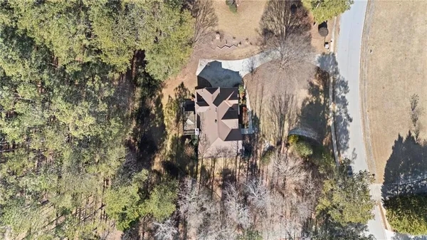 a aerial view of a house with a yard