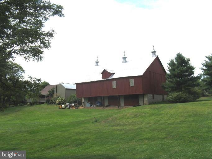 11625 Walnut Point Road Hagerstown, MD 21740 - Photo 2 of 25 a view of a house with a big yard potted plants and large tree