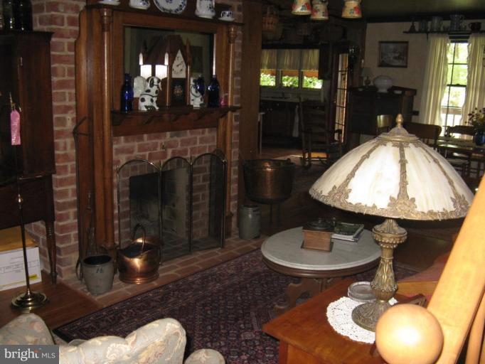 11625 Walnut Point Road Hagerstown, MD 21740 - Photo 12 of 25 a living room with furniture and a fireplace
