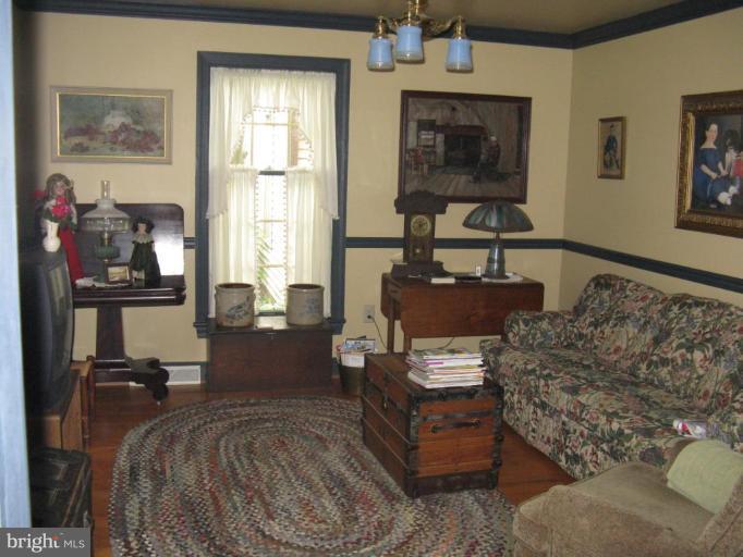 11625 Walnut Point Road Hagerstown, MD 21740 - Photo 13 of 25 a bed room with furniture and a window