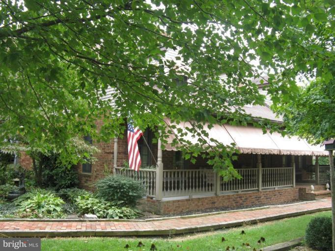 11625 Walnut Point Road Hagerstown, MD 21740 - Photo 4 of 25 a backyard of a house with lots of green space