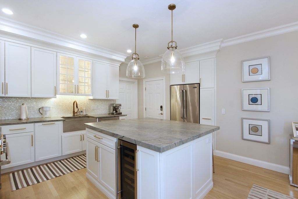 42 Fells Pond Road Mashpee, MA 02649 - Photo 11 of 35 a kitchen with stainless steel appliances granite countertop a sink a stove a refrigerator and island