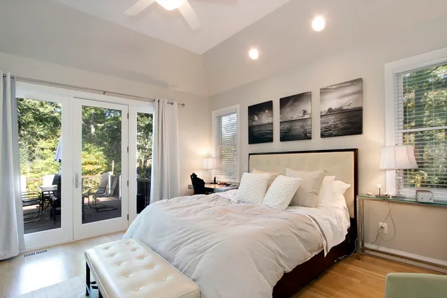 a bedroom with a large bed and a window