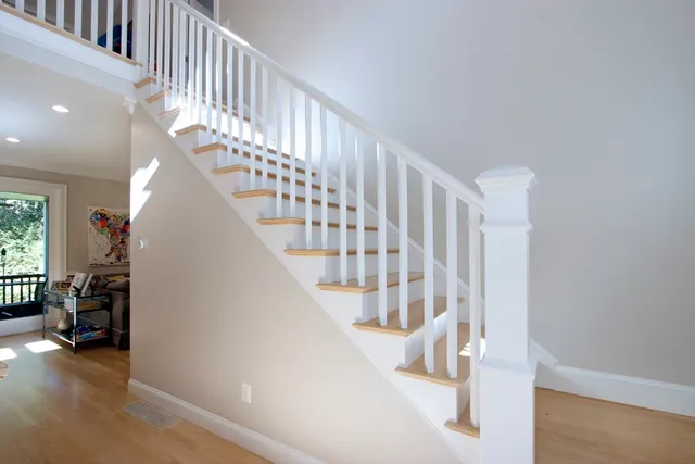 a view of entryway and hall with wooden floor