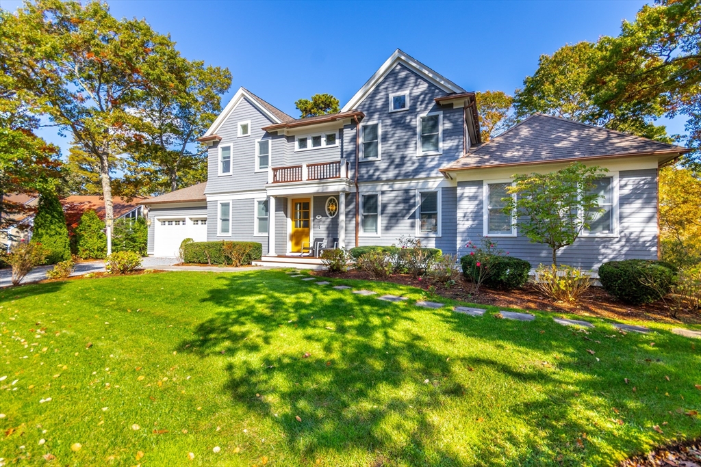 42 Fells Pond Road Mashpee, MA 02649 - Photo 25 of 35 a front view of a house with a yard