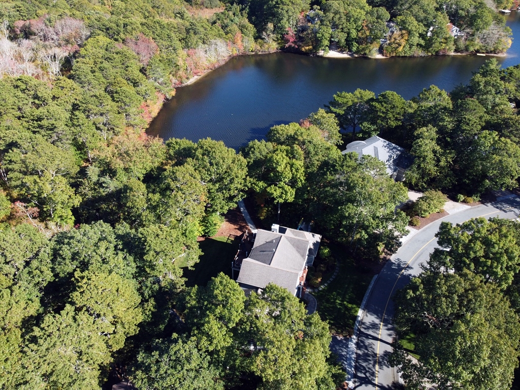 42 Fells Pond Road Mashpee, MA 02649 - Photo 30 of 35 an aerial view of a house with a yard