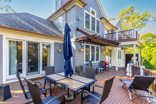 a view of a patio with a table and chairs