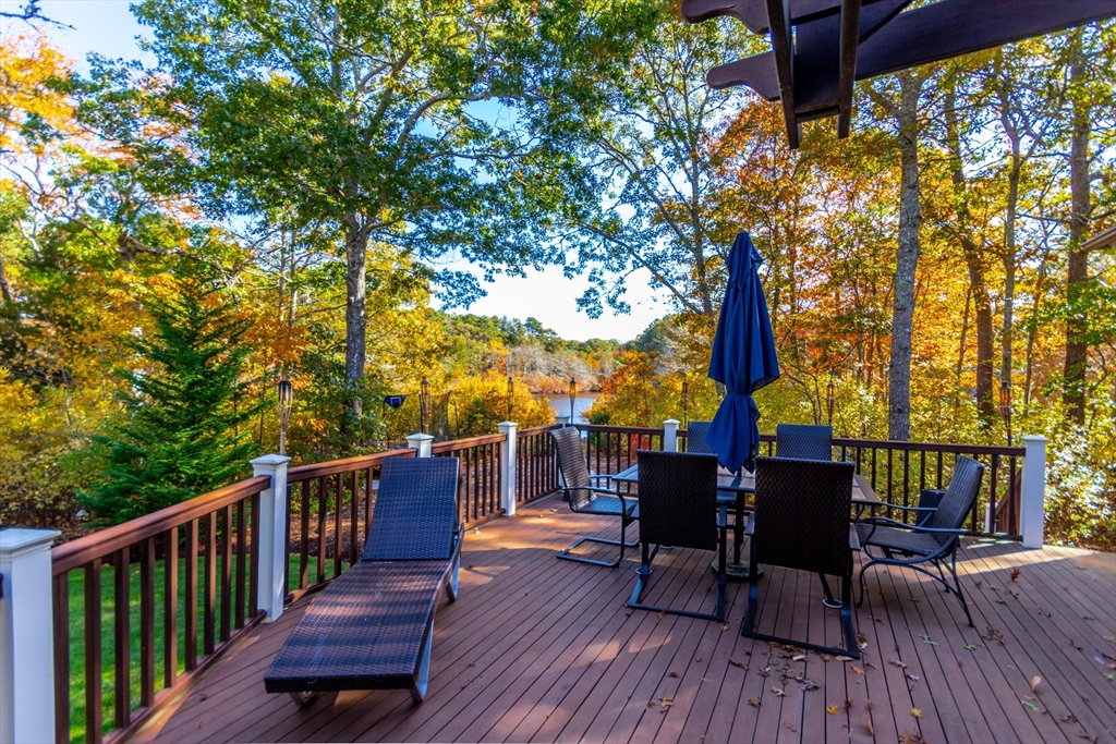 42 Fells Pond Road Mashpee, MA 02649 - Photo 33 of 35 a view of deck with furniture and trees around