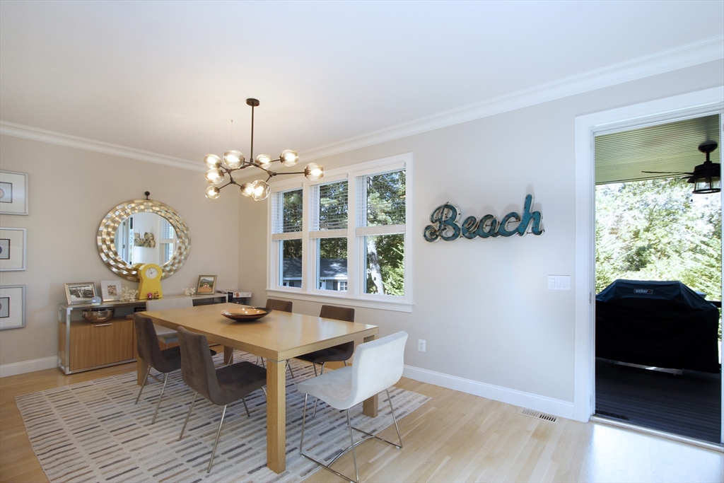 42 Fells Pond Road Mashpee, MA 02649 - Photo 8 of 35 a view of a dining room with furniture window and wooden floor