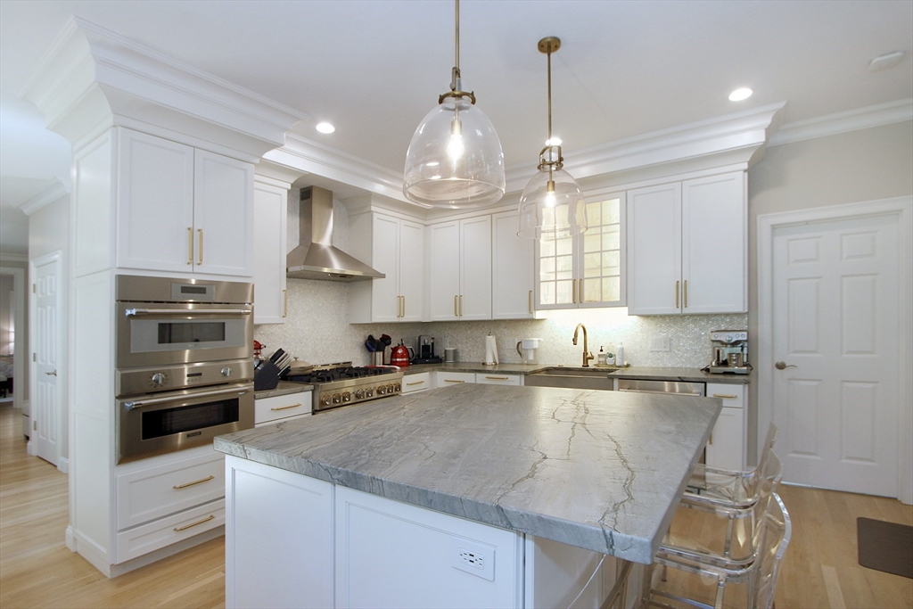42 Fells Pond Road Mashpee, MA 02649 - Photo 10 of 35 a kitchen with granite countertop a sink a counter space appliances and cabinets