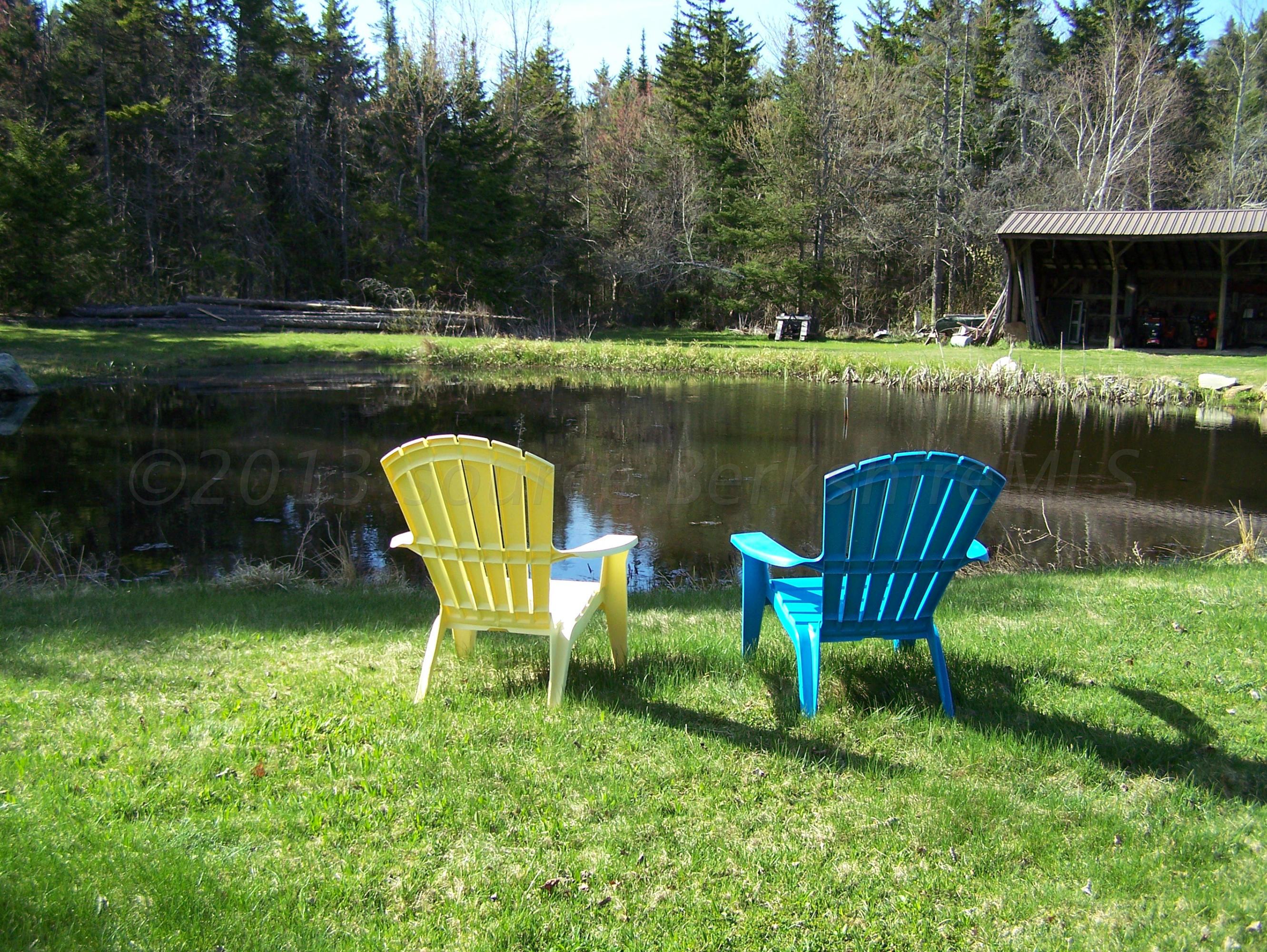 1475 Savoy Road Windsor, MA 01270 - Photo 14 of 61 a view of a table and chairs in the garden