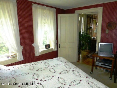 1475 Savoy Road Windsor, MA 01270 - Photo 29 of 61 a bedroom with a bed and large window with wooden floor