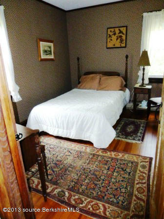 1475 Savoy Road Windsor, MA 01270 - Photo 31 of 61 a bedroom with a bed and dresser with mirror