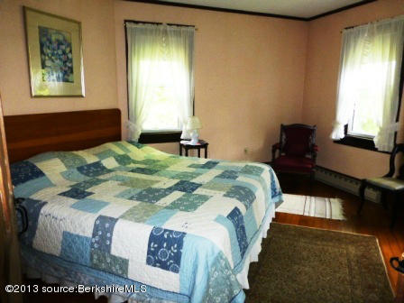 1475 Savoy Road Windsor, MA 01270 - Photo 33 of 61 a bedroom with a bed and wooden floor