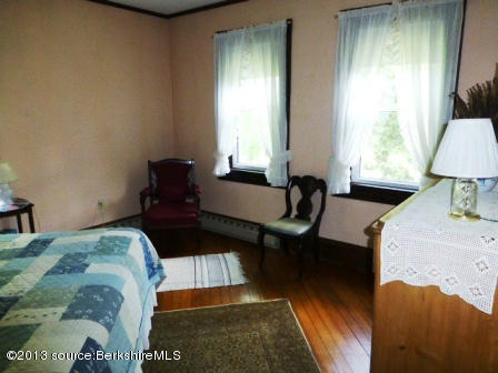 1475 Savoy Road Windsor, MA 01270 - Photo 34 of 61 a bedroom with a bed and wooden floor